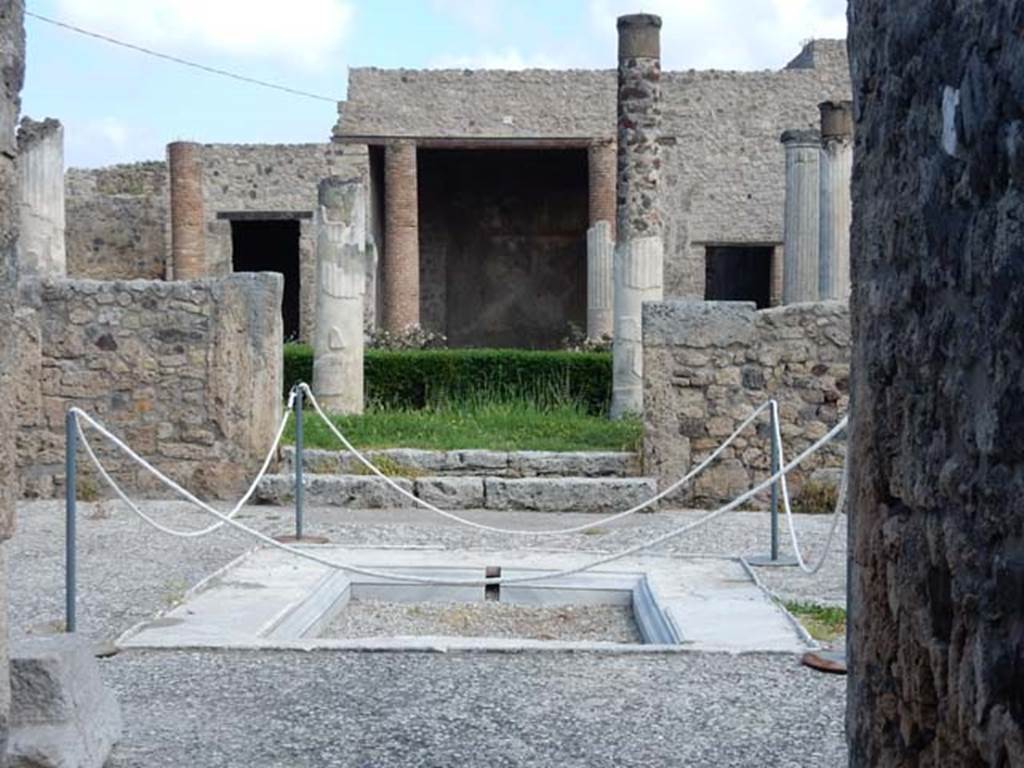 VII.7.5 Pompeii. May 2015. Looking north across marble impluvium in atrium (b). 
The floor of the atrium is a beaten mixture of small fragments of marble.
Photo courtesy of Buzz Ferebee.