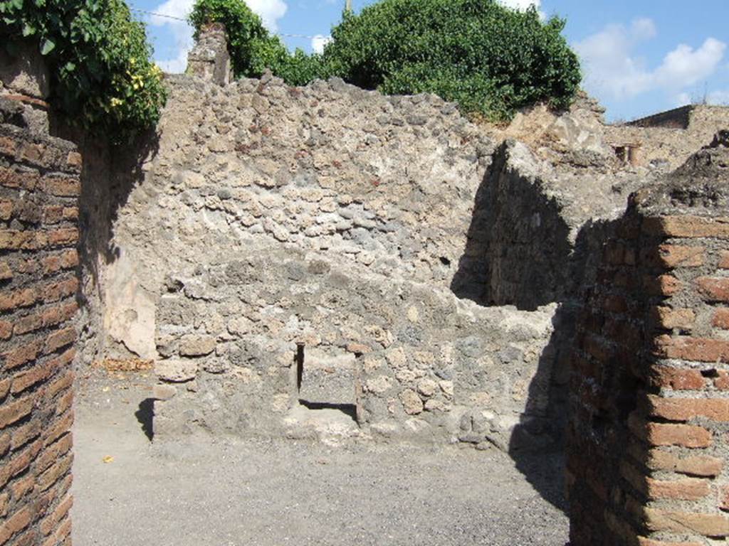 VII.7.9 Pompeii. September 2005. 
Looking through doorway of stairs at VII.7.8, into south-east room and rear room of VII.7.9.