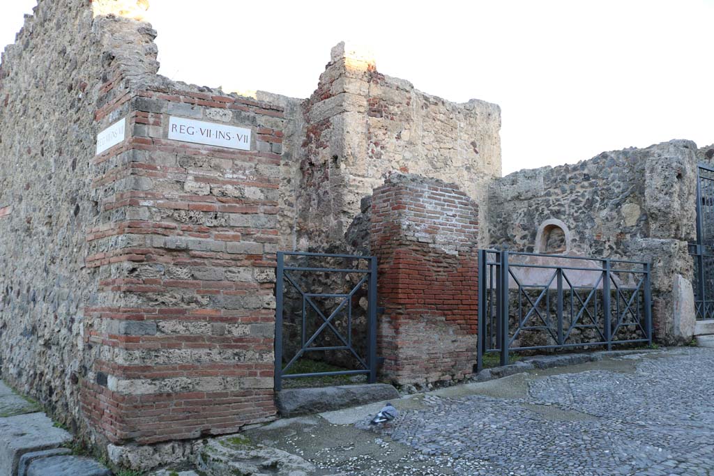 VII.7.11 Pompeii on right with VII.7.12 on left. December 2018. 
Looking north-east towards entrance doorways from Via Marina. Photo courtesy of Aude Durand.