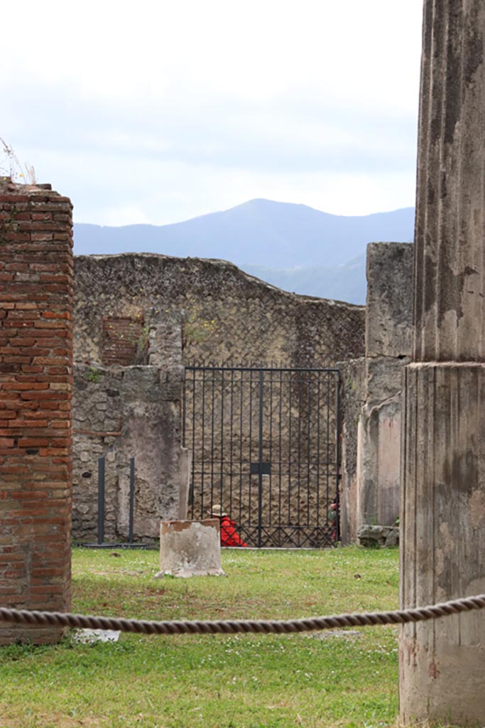 VII.7.13 Pompeii. May 2024. 
Looking south across atrium towards entrance doorway at VII.7.10. Photo courtesy of Klaus Heese.
