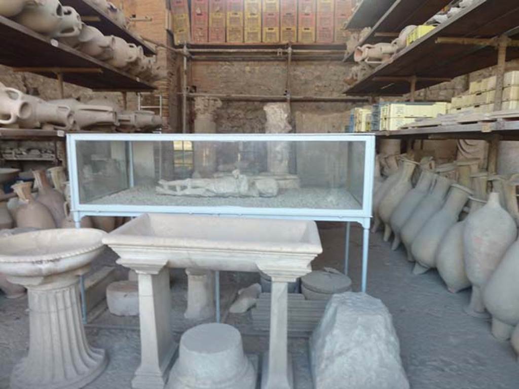 VII.7.29 Pompeii. September 2015. Looking towards the same items in storage, except that the plaster cast in the display cabinet has been changed.