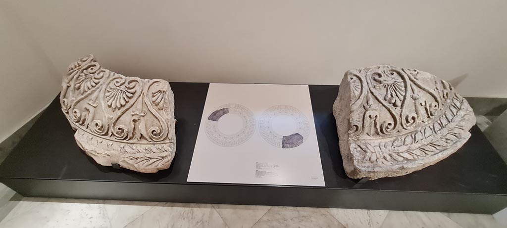 From the Forum ?. April 2023. 
Two marble fragments of a clipeus, large monumental medallions used in architecture that imitate the shape of a shield.
On display in “Campania Romana” gallery in Naples Archaeological Museum. Photo courtesy of Giuseppe Ciaramella.