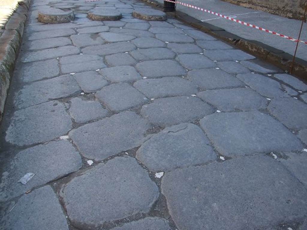 VII.7.32 Pompeii. March 2009. White insert in road surface in Via Marina, outside Temple entrance.