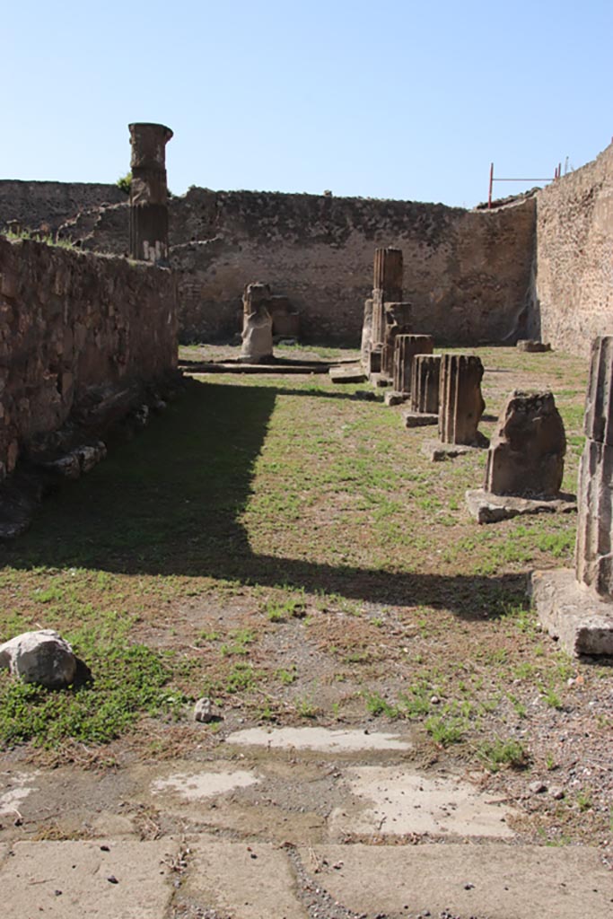 VII.7.32 Pompeii. October 2023. 
Looking west across north side of rear of temple. Photo courtesy of Klaus Heese.