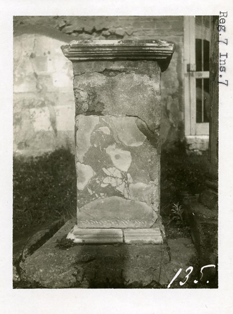 VII.7.32 Pompeii. Pre-1937-39. 
Looking north to statue base, presumably in north-east corner with doorway in rear north wall.
Photo courtesy of American Academy in Rome, Photographic Archive. Warsher collection no. 135.