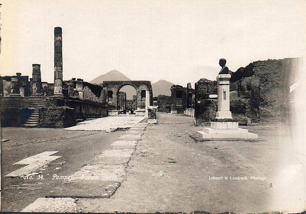 VII.8 Pompeii Forum. 1910. East side of Forum with bust of Giuseppe Fiorelli.
The bust is now in the Larario dei Pompeianisti. Photo courtesy of Ross Turner.
The bronze bust of Fiorelli was erected in the Forum at Pompeii in 1895, a year before his death.  
The inscription on the front of the pedestal reads:
          IOSEPHO FIORELLI
DE ANTIQVITA TIBUS POMPEIANIS
            OPTIME MERITO
       EX PVBLICO DECRETO
          CIVES VIVENTI CIVI
             POSVERVNT
              MDCCCXCV