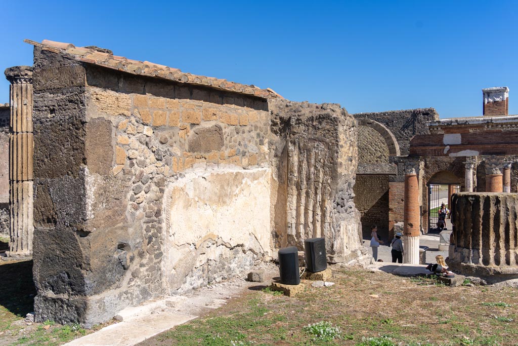 VII.8.1 Pompeii. October 2023.  
Looking north-east along exterior wall on east side of Temple doorway. Photo courtesy of Johannes Eber.