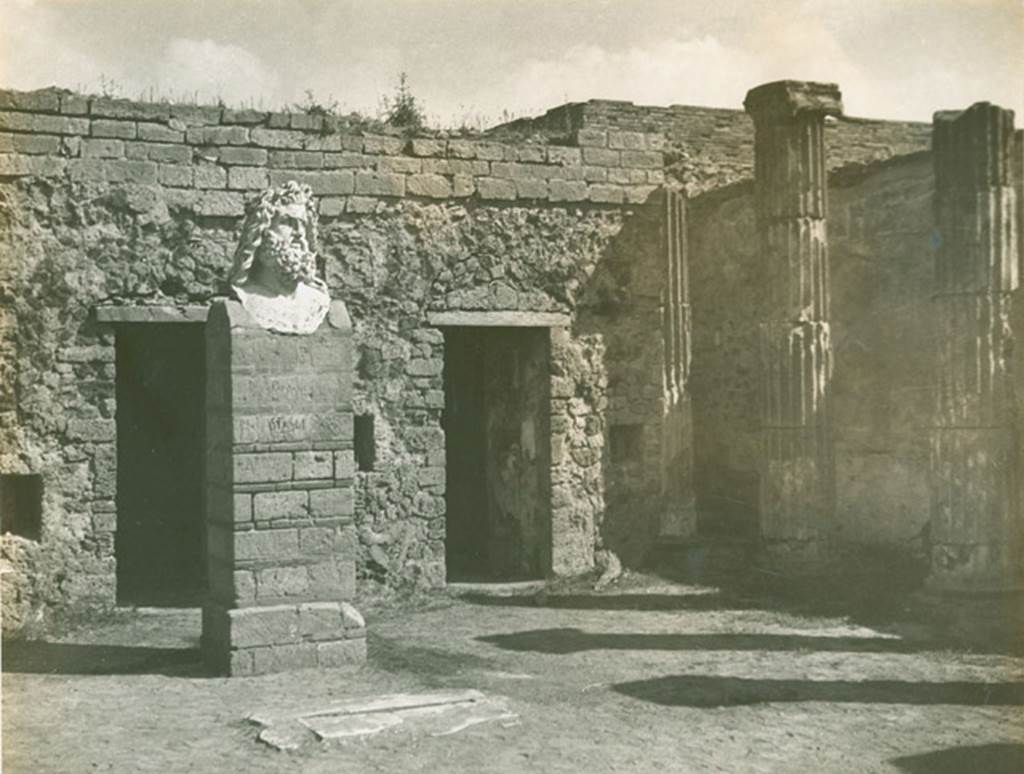 VII.8.1 Pompeii. 1944. Head of Jupiter on podium of temple.