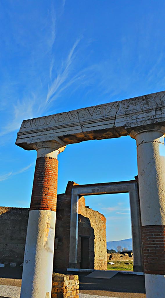 VII.9.1 Pompeii. 2017/2018/2019. 
Looking east through portico towards north side of entrance doorway. 
Photo courtesy of Giuseppe Ciaramella.