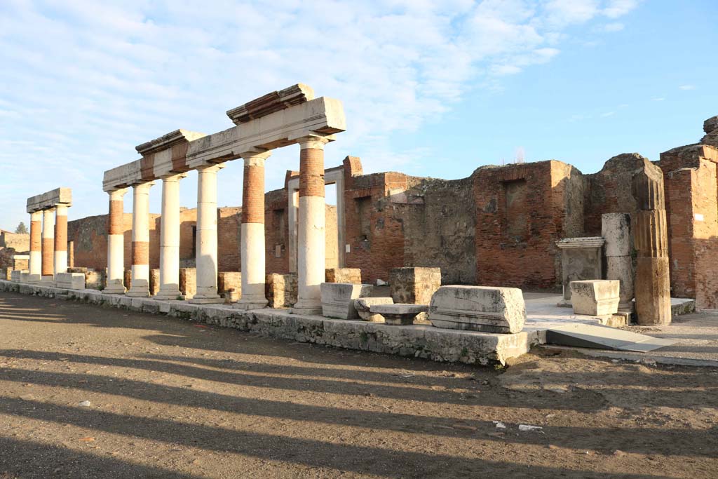 VII.9.1 Pompeii. December 2108. 
Looking north-east across Forum towards the portico in front of Eumachia’s building, with junction to Via dell’Abbondanza, on right. 
Photo courtesy of Aude Durand.