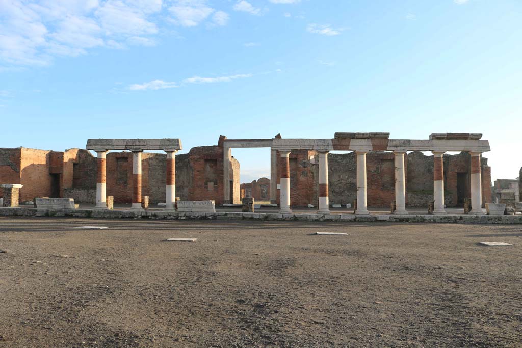 VII.9.1 Pompeii. December 2018. 
Looking east across Forum towards portico, and entrance doorway to Eumachia’s Building. Photo courtesy of Aude Durand.