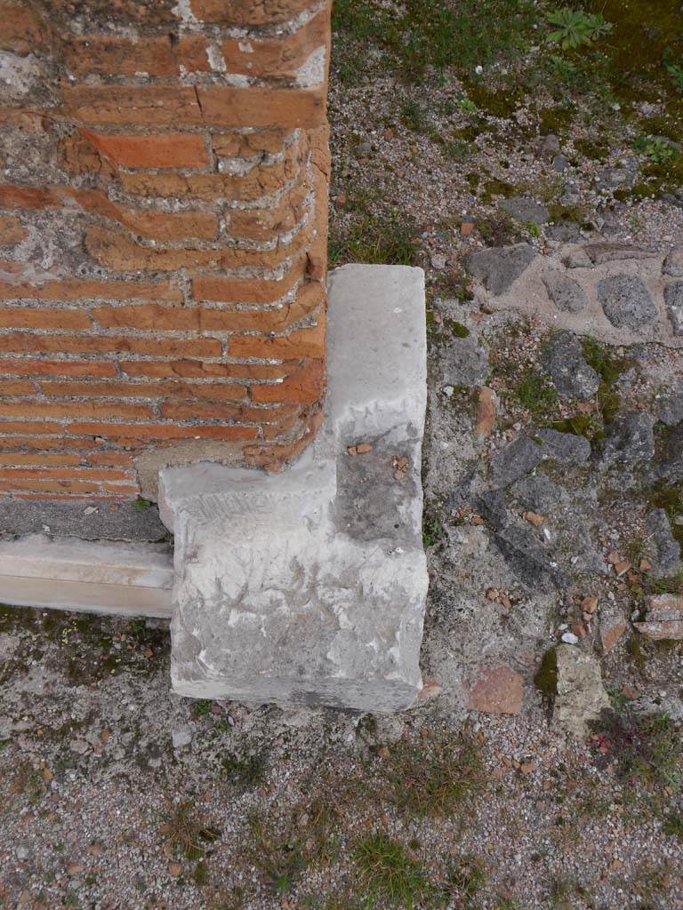 VII.9.2 Pompeii. March 2019. Detail of base on north side of doorway to cella. 
Foto Anne Kleineberg, ERC Grant 681269 DÉCOR.