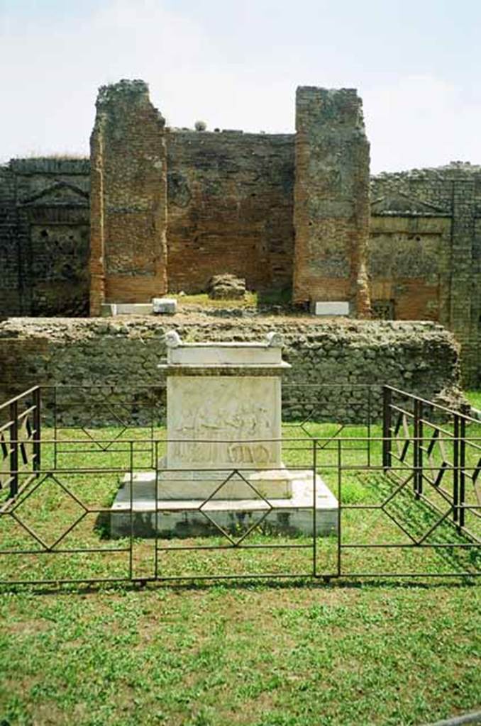 VII.9.2 Pompeii. July 2010. Altar, with low diamond pattern fence, cella and podium. 
Photo courtesy of Rick Bauer.