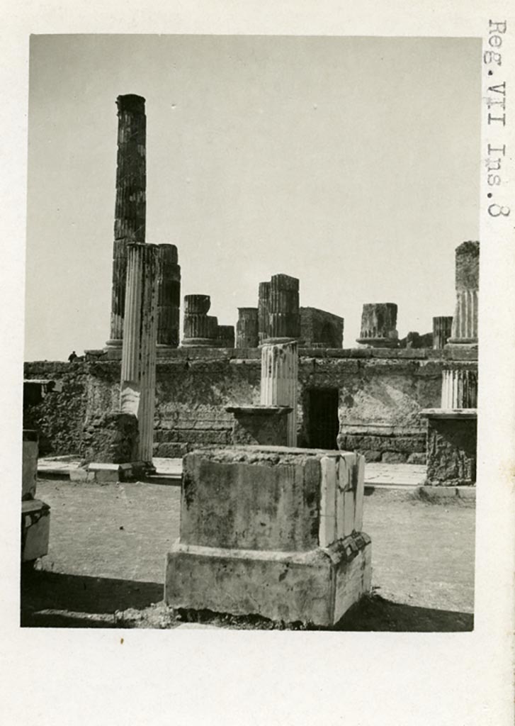 VII.9.8 and 7 Pompeii. Pre-1937-39. 
Looking west across statue bases in north-east corner of Forum (VII.8) towards Temple of Jupiter.
Photo courtesy of American Academy in Rome, Photographic Archive. Warsher collection no. 1116.