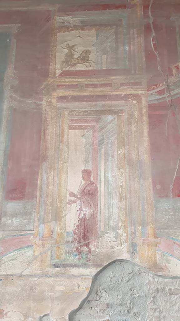 VII.9.7/8 Pompeii. August 2021. 
Painted panel with figure from north side of central painting on west wall.
Foto Annette Haug, ERC Grant 681269 DÉCOR.