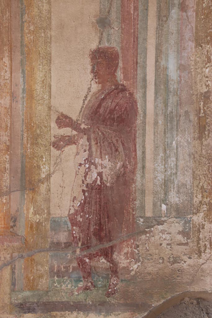 VII.9.7 and VII.9.8 Pompeii. Macellum. October 2022. 
Painted figure in toga. Photo courtesy of Klaus Heese.