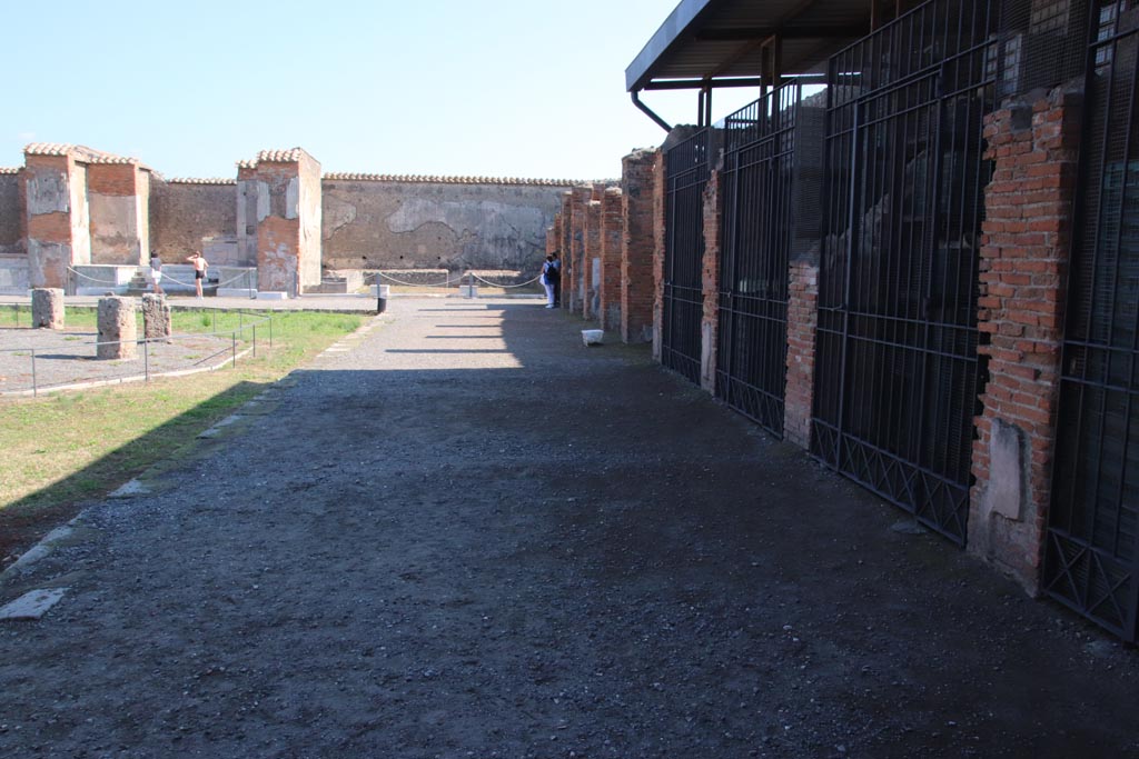 VII.9.7 and VII.9.8 Pompeii. October 2022. Looking east along shops against south wall, from south-west corner. Photo courtesy of Klaus Heese.