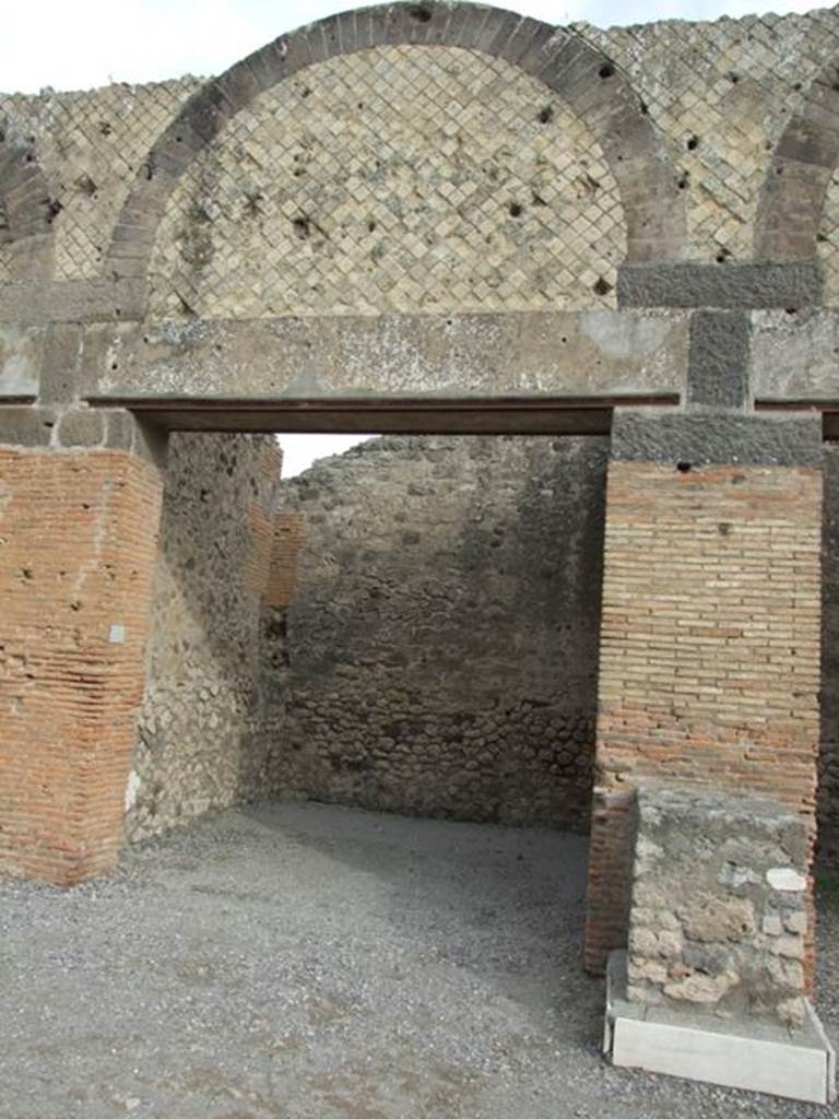VII.9.11 Pompeii. December 2007. Entrance with north wall to the left, and statue base to the right.