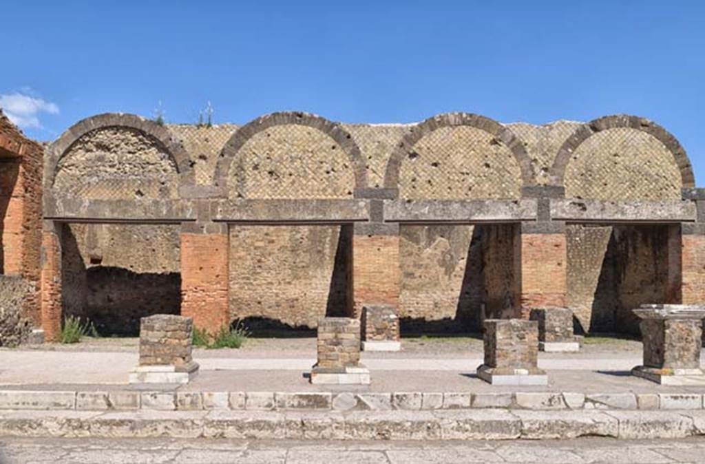VII.9.12 Pompeii, on left. April 2018. Looking east towards exterior facades of shops at VII.9.12/11/10 and 9. Photo courtesy of Ian Lycett-King.  Use is subject to Creative Commons Attribution-NonCommercial License v.4 International.