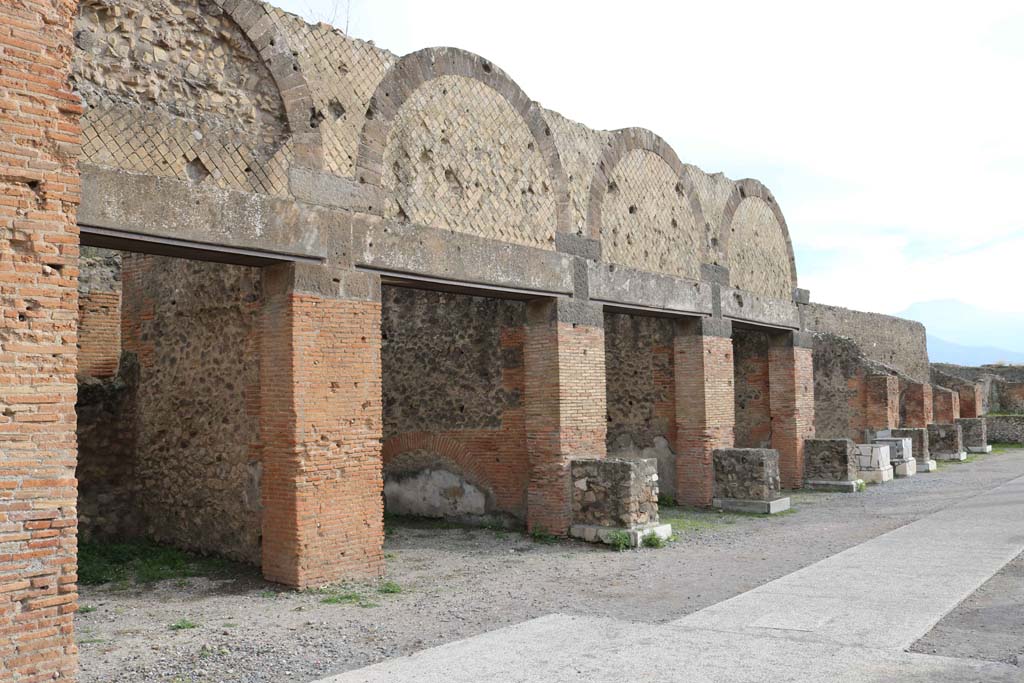 VII.9.12 Pompeii, on left. December 2108. 
Looking south along shop doorways on east side of Forum, in north-east corner. Photo courtesy of Aude Durand.