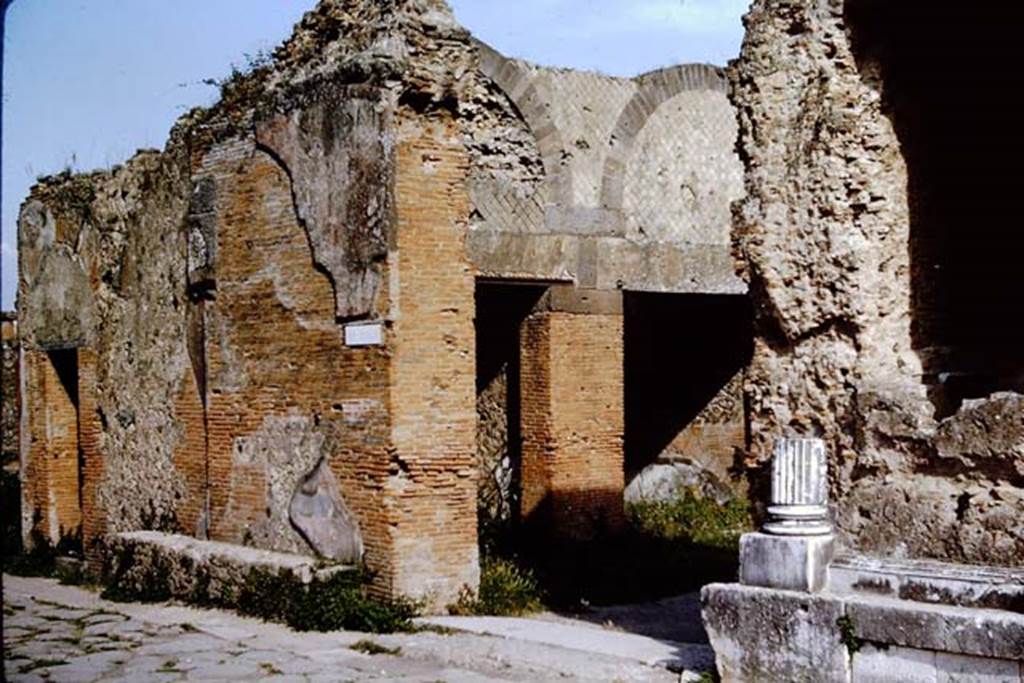 VII.9.12 Pompeii. 1964. On the left is the doorway of VII.9.13, then a bench against the exterior wall of VII.9.12, which is visible through the entrance to the Forum. Photo by Stanley A. Jashemski.
Source: The Wilhelmina and Stanley A. Jashemski archive in the University of Maryland Library, Special Collections (See collection page) and made available under the Creative Commons Attribution-Non Commercial License v.4. See Licence and use details.
J64f1320