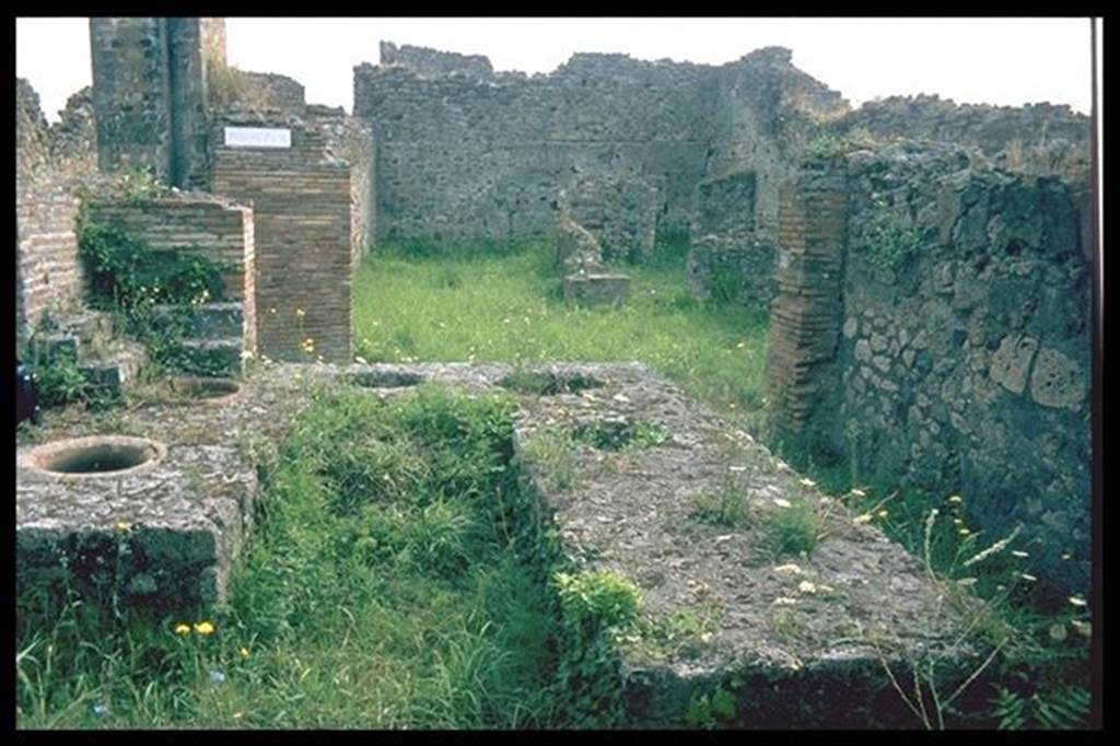 VII.9.54 Pompeii. Looking east across counter towards doorway VII.9.55 on Vicolo di Eumachia and VII.10.7, on the other side. Photographed 1970-79 by Günther Einhorn, picture courtesy of his son Ralf Einhorn.