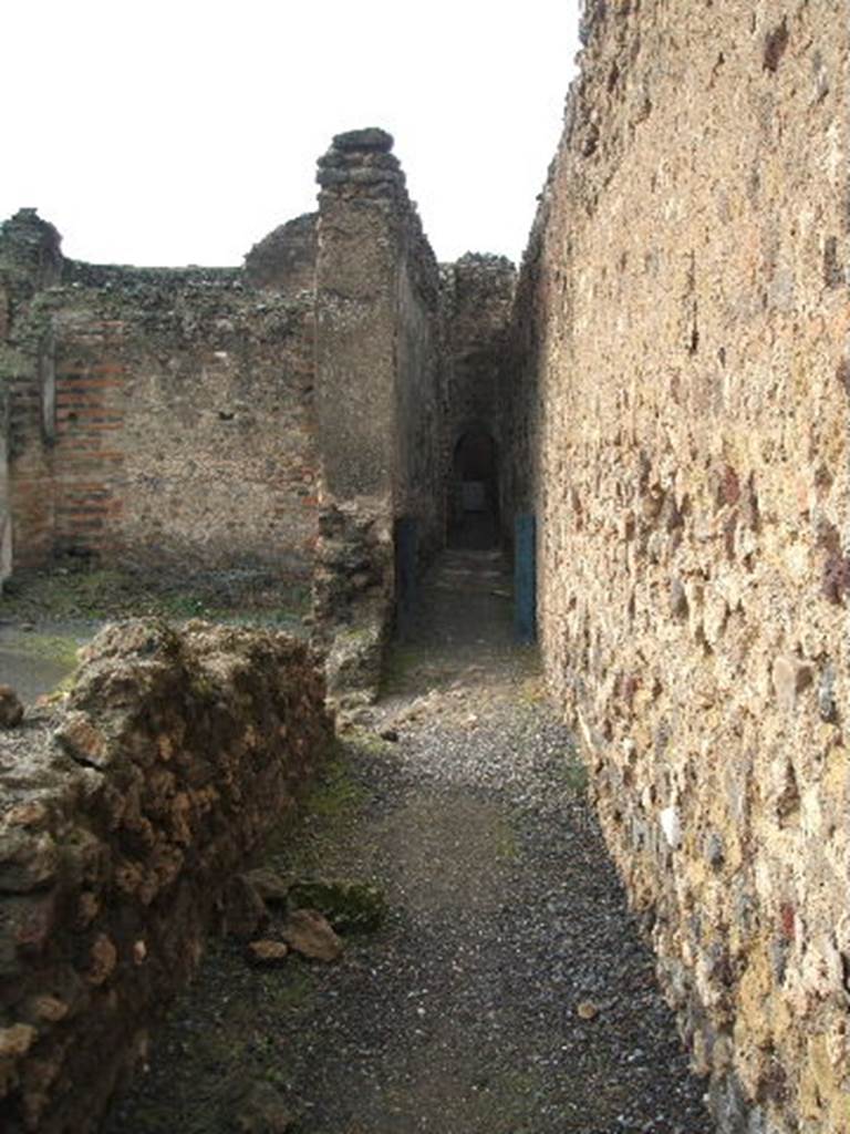 VII.9.66 on right hand side 
in Passage at back of Eumachia’s building