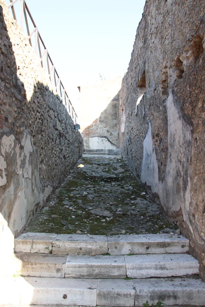 VII.9.67 Pompeii. October 2022. 
Looking north to stairs and ramp to upper floor, at rear of Eumachia’s Building.
Photo courtesy of Klaus Heese.