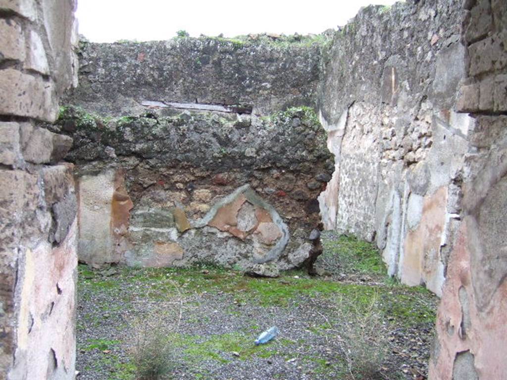VII.10.3 Pompeii. December 2005.  Looking south through doorway of room 9 towards doorway of room 22, possibly a small storeroom, on right. Looking south across room 9, a triclinium which originally had a floor of cocciopesto. According to Amoroso, the walls of room 9 were recovered with painted plaster made of wide red and yellow sections, separated by white panels. The zoccolo was painted with plant motifs. 
Studi della Soprintendenza archeologica di Pompei, 22: l”Insula VII, 10 di Pompei , by Angelo Amoroso. (p.74)