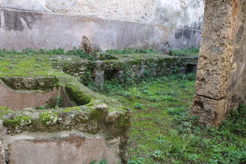 VII.10.13, Pompeii. December 2018. 
Looking west from entrance doorway towards basin and two hearths, near south wall. Photo courtesy of Aude Durand.