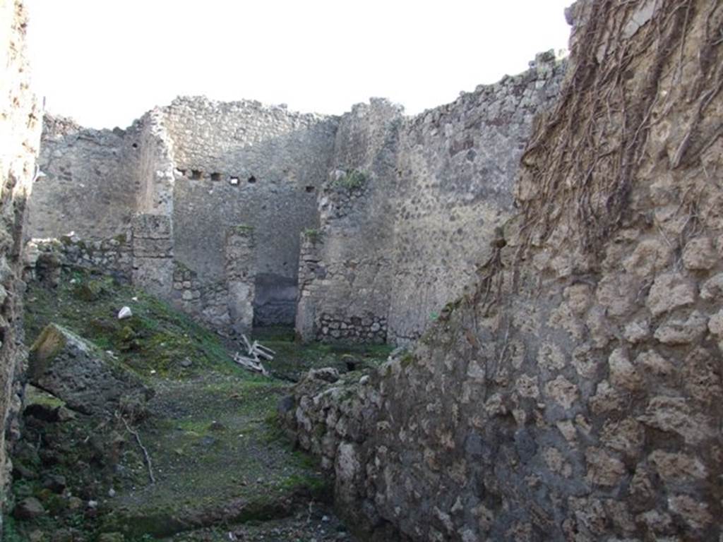 VII.11.2 Pompeii. December 2007. South wall of fauces and looking east to rear of dwelling.