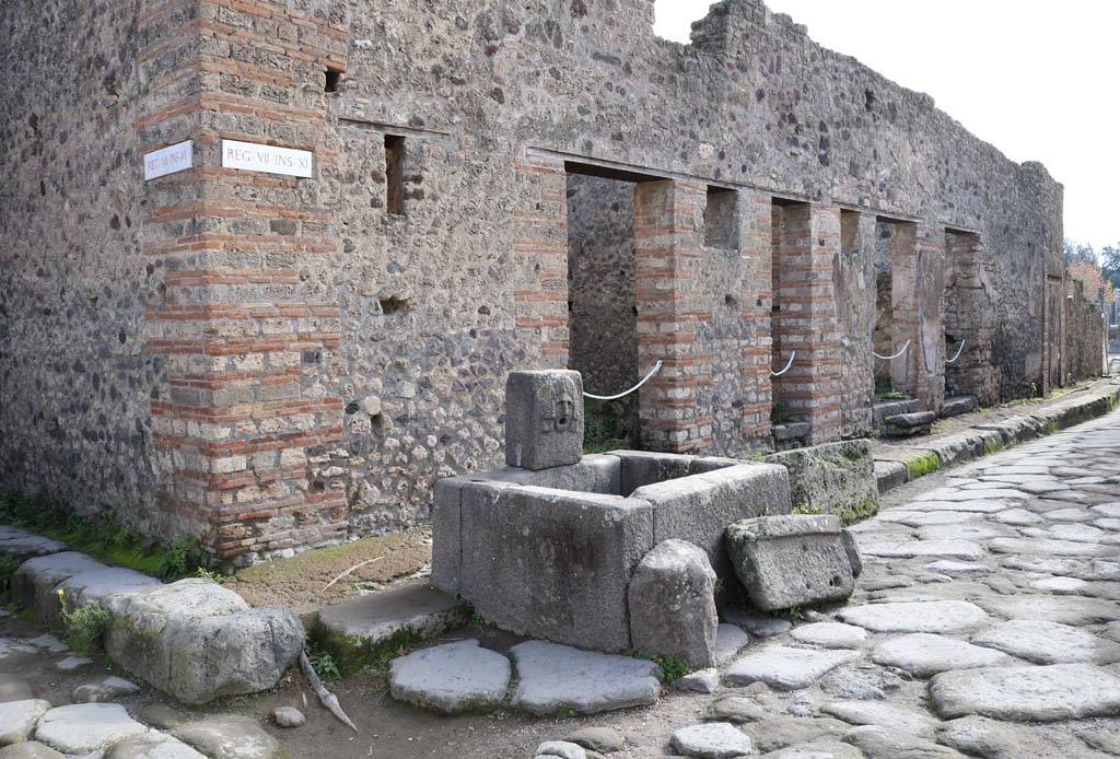 VII.11.5, Pompeii. December 2018. 
Looking south from fountain outside VII.11.5, on east side of Vicolo della Maschera. Photo courtesy of Aude Durand.