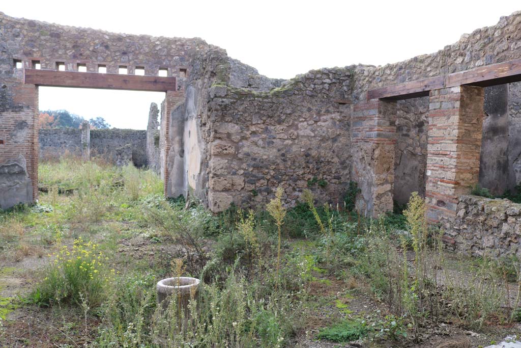 VII.11.6 Pompeii. December 2018. 
Looking towards south-west side of atrium, from entrance doorway. 
The doorway on the right is into the triclinium. Photo courtesy of Aude Durand.
According to PPM –
“Sull’atrio compluviato (a) si aprono i cubicoli (b), (c) e il triclinio (e) che sulle pareti aveva conservato le impronte dei letti di legno”.
(In the compluviate atrium (a), were two cubiculi (b) and (c), and the triclinium (e) which had preserved on the walls the imprints of the wooden beds/couches.)
See Carratelli, G. P., 1990-2003. Pompei: Pitture e Mosaici. VII. (7). Roma: Istituto della enciclopedia italiana, (p.446)