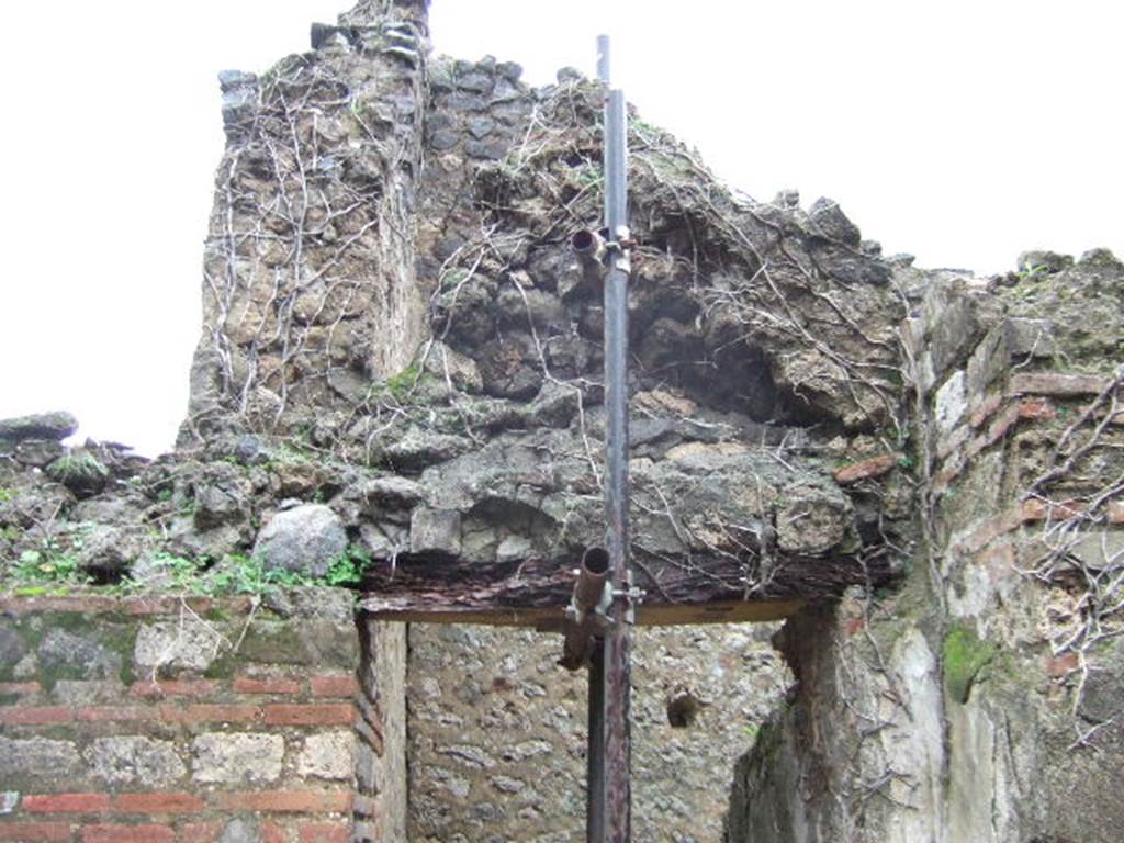 VII.11.6 Pompeii. December 2005. Remains above stairs to upper floor on east side of atrium.
