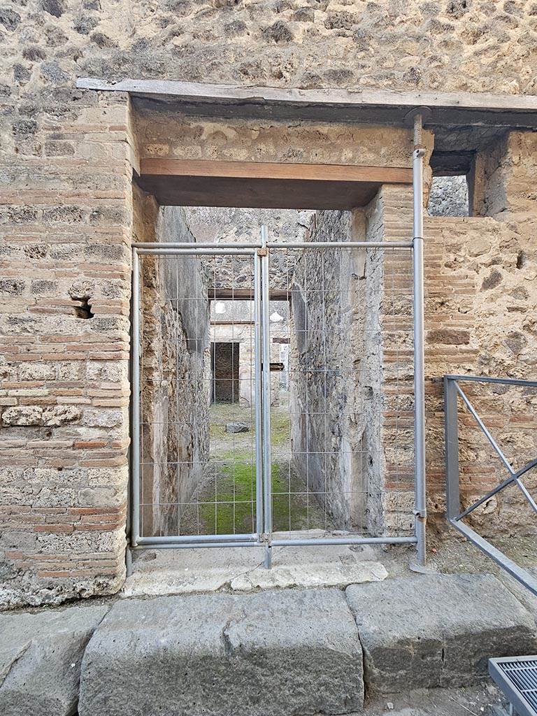 VII.11.11 Pompeii. November 2024. 
Looking south through entrance doorway. Photo courtesy of Annette Haug.