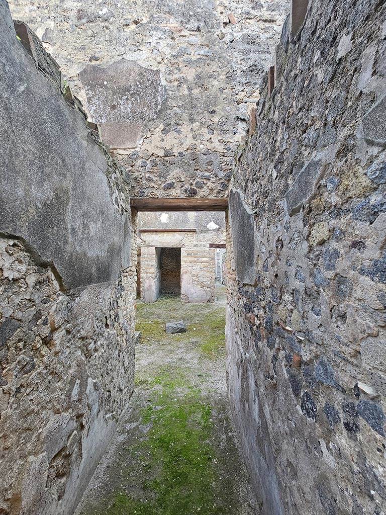 VII.11.11 Pompeii. November 2024. 
Looking south along entrance corridor towards atrium. Photo courtesy of Annette Haug.