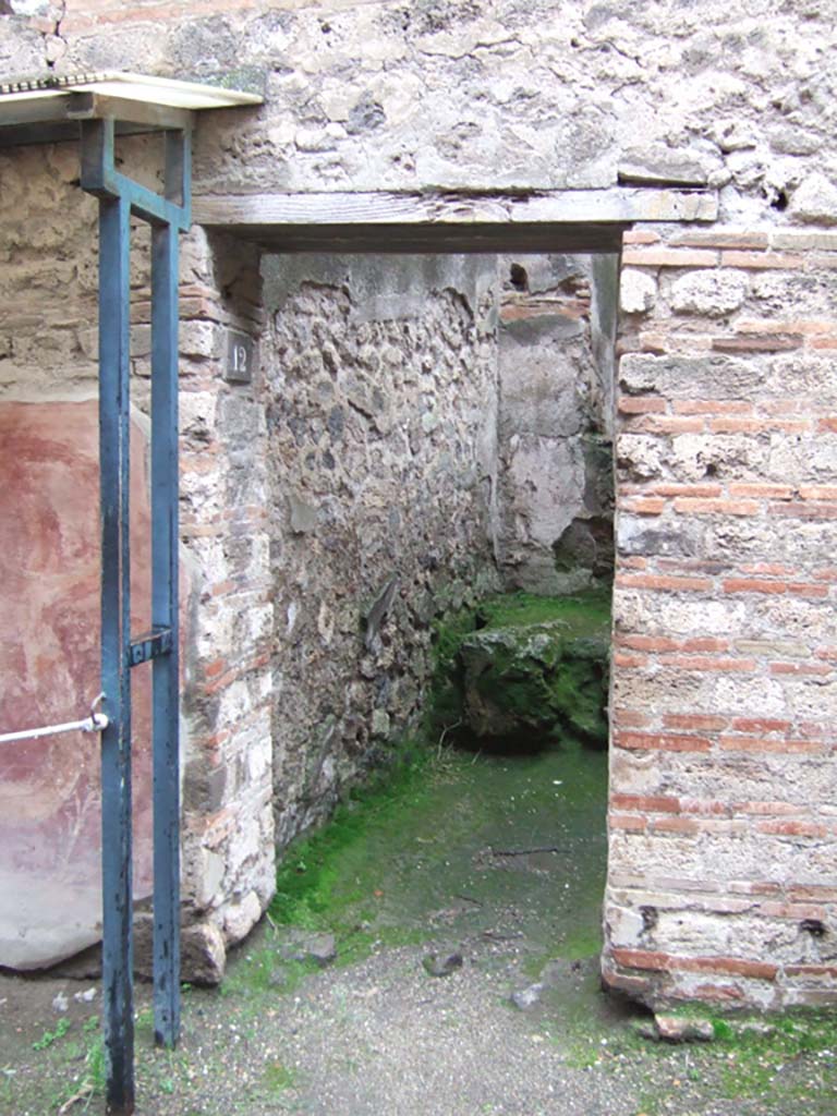 VII.11.12 Pompeii. December 2005. Entrance doorway to cella meretricia.  
According to Varone and Stefani, the wording of CIL IV 813 (but numbered as CIL IV 814) and CIL IV 815 were found near the doorway of VII.11.12.
CIL IV 814 was on the left, and CIL IV 815 was on the right. 
See Varone, A. and Stefani, G., 2009. Titulorum Pictorum Pompeianorum, Rome: L’erma di Bretschneider, (p.359).
See also VII.11.13.