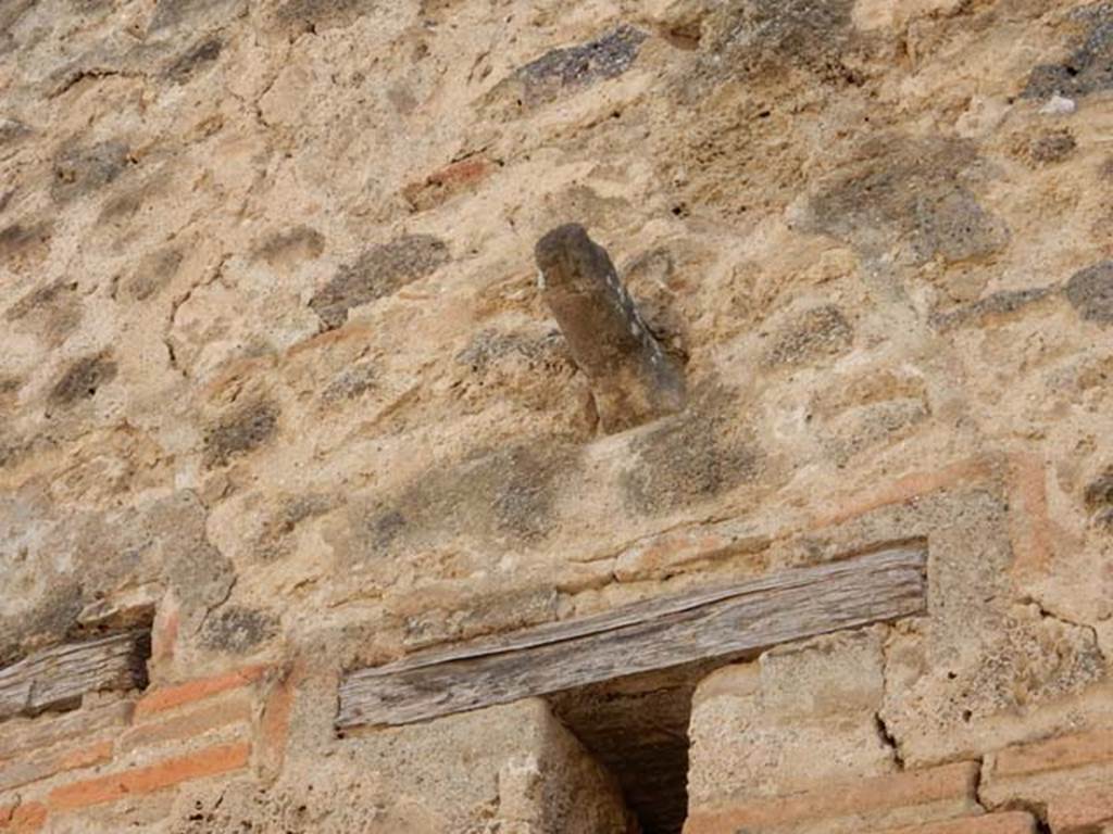 VII.11.12 Pompeii. May 2016. Phallus on outside wall above small window above doorway. Photo courtesy of Buzz Ferebee.
