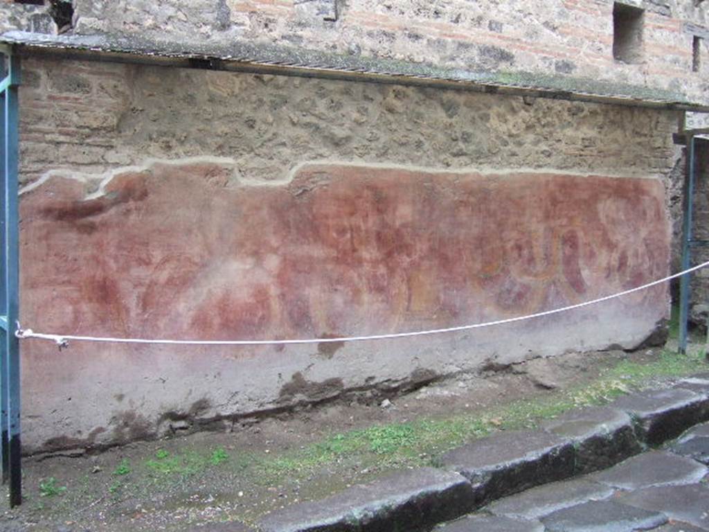VII.11.13 Pompeii. December 2005. Painted street shrine.
According to Fiorelli, “a painting adorned the exterior of this edifice facing the House of Siricus. In the painting were two serpents, one male and one female, approaching an altar from either side. On the altar were two pine cones and two eggs. Above was written in white letters –
OTIOSIS . LOCVS   HIC . NON EST DISCEDE
                                 MORATOR
and then to the right towards the extremity of the painting, written in white, a record of the wine drunk in the inn, with above
L(V)MPAS
ROMANESES
which I believe is a reference to the Genius of the nearby baths”.
See Pappalardo, U., 2001. La Descrizione di Pompei per Giuseppe Fiorelli (1875). Napoli: Massa Editore. (p.110)
