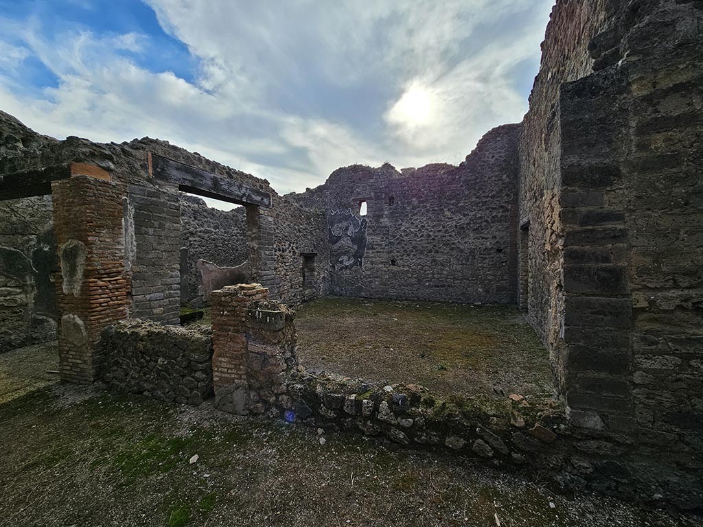 VII.11.14 Pompeii. November 2024. 
Looking south along west wall of garden area “A”, on right, from tablinum. Photo courtesy of Annette Haug.