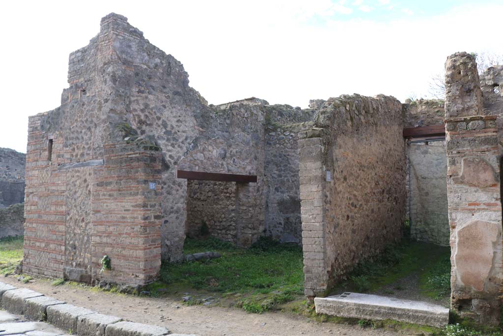 VII.11.15 Pompeii on left. December 2018. 
Looking south-west to entrances on west side of Vicolo del Lupanare. Photo courtesy of Aude Durand.