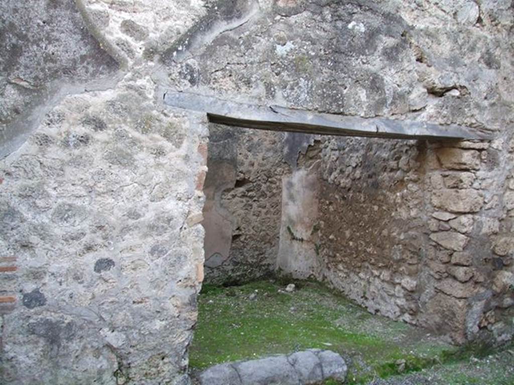 VII.11.15 Pompeii. December 2006. South wall with doorway to side room, to left of entrance.