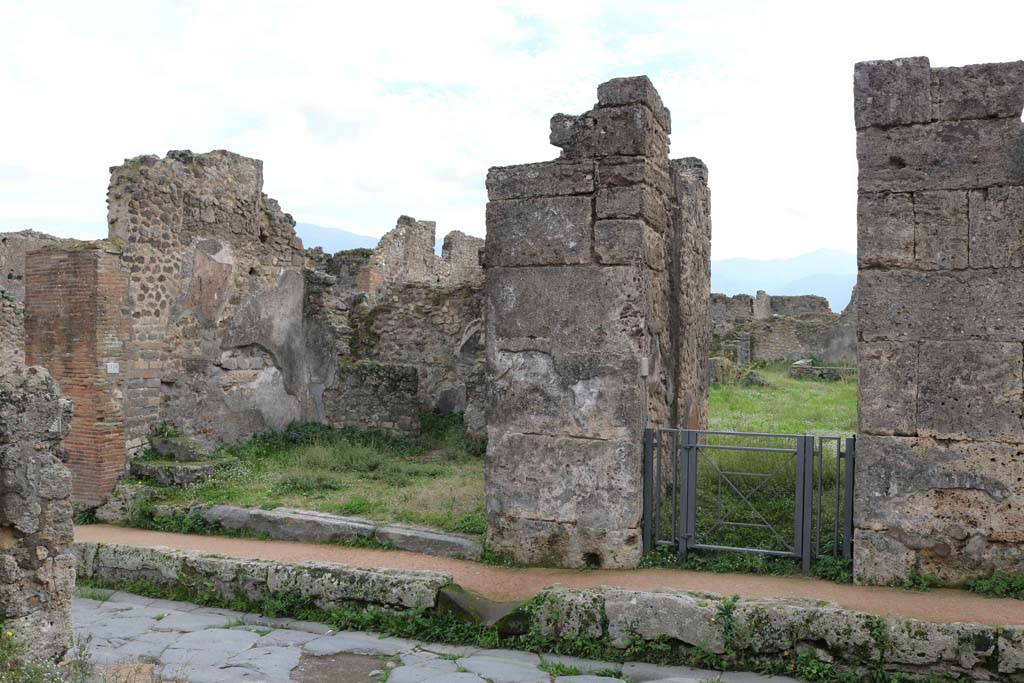 VII.12.4 Pompeii on left and VII.12.3 on right. December 2018. 
Looking south on Via degli Augustali towards doorways. Photo courtesy of Aude Durand.