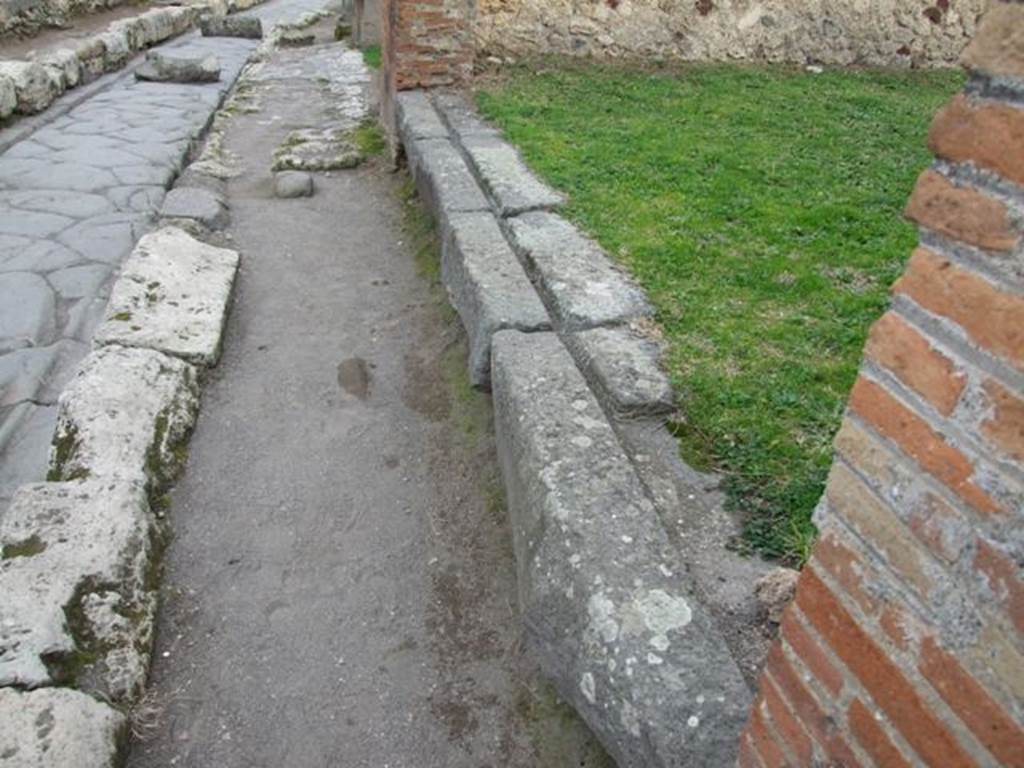 VII.12.5 Pompeii. December 2007.  Entrance and threshold or sill, looking east on Via degli Augustali.
