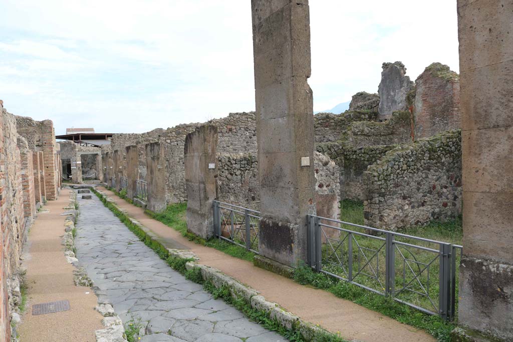Via degli Augustali, Pompeii. December 2018. Looking east between VII.2 on left and VII.12.8 on right. Photo courtesy of Aude Durand.