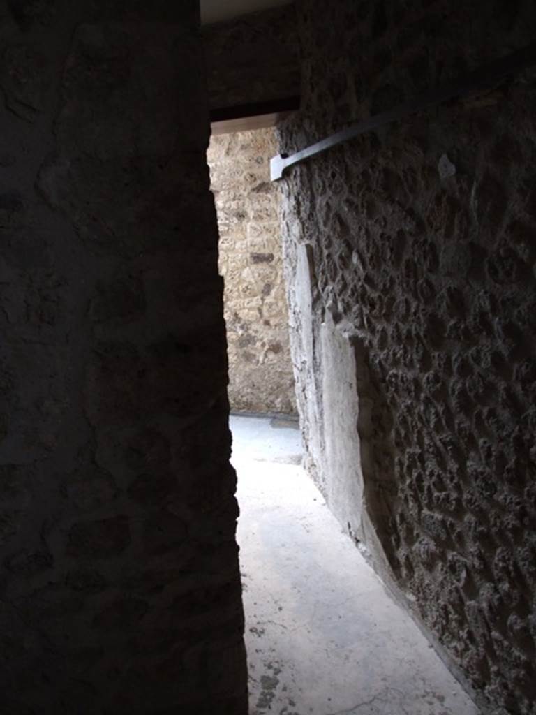 VII.12.20  Pompeii.  March 2009.  Doorway out of  Room 5.
