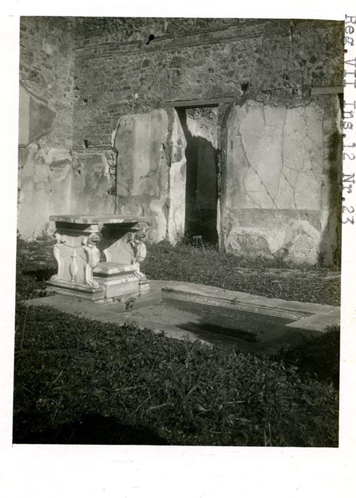 VII.12.21 Pompeii. Pre 1937-39. Looking north-east across impluvium in atrium.
The marble table is in place on the end of the impluvium
Photo courtesy of American Academy in Rome, Photographic Archive. Warsher collection no. 1504.
See also Warscher T, 1948. Marmi di Pompeii: Vol. 3. Rome: Swedish Institute, fig. 133.