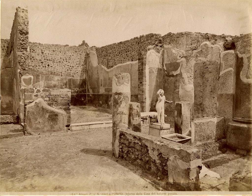 VII.12.28 Pompeii. Looking from west portico towards north portico and white marble threshold of the exedra, with painted decoration.
Fratelli Alinari 11345a, Public domain, via Wikimedia Commons