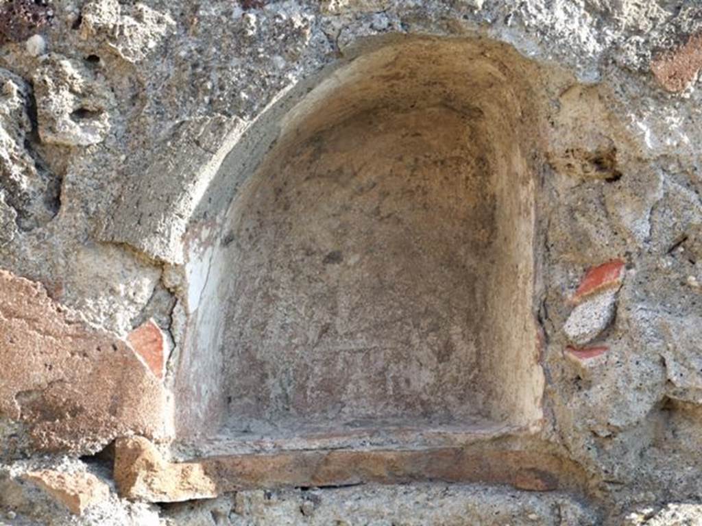 VII.13.7 Pompeii. December 2007. Niche on east wall of dwelling.
According to Boyce, in the east wall of the back room, above the hearth, was a small arched niche.
See Boyce G. K., 1937. Corpus of the Lararia of Pompeii. Rome: MAAR 14. (p.71, no.324, with Pl.2,5)
