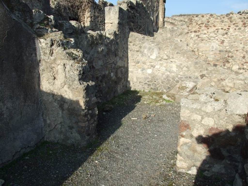 VII.13.9 Pompeii. December 2007. North wall of rear room, with doorway into a yard.
